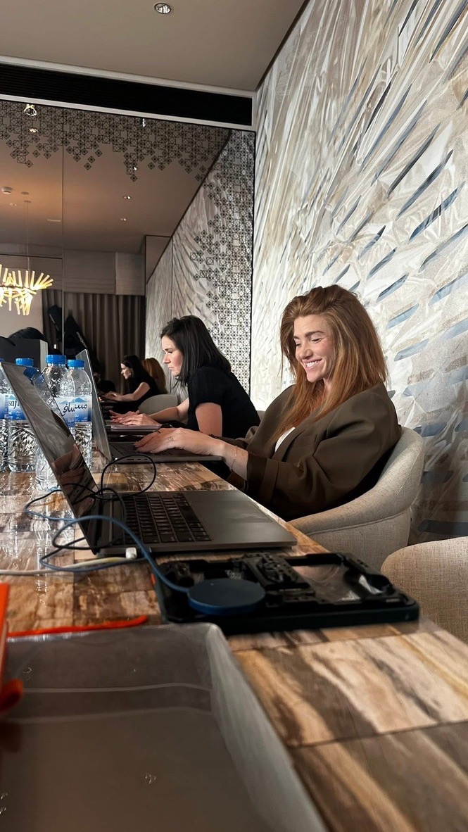 Kristen and the team in a production working session