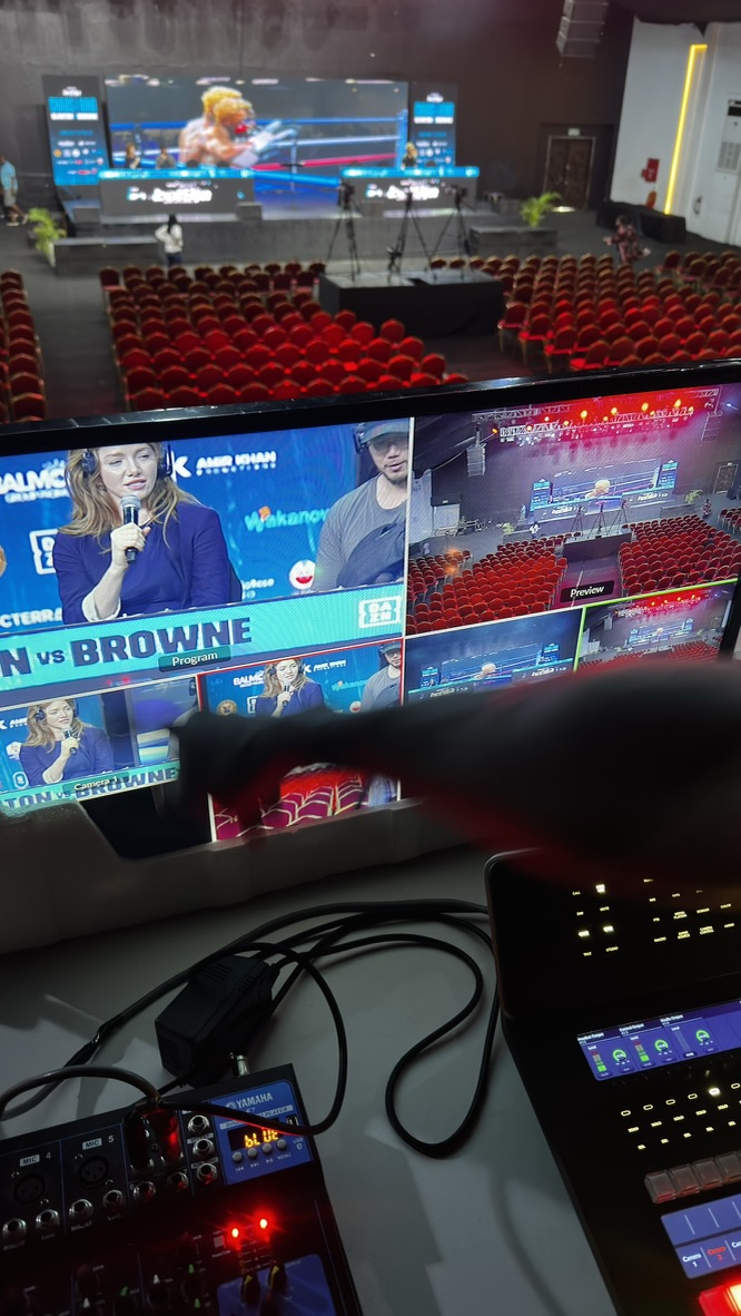 Kristen on the broadcast multiview monitor, mix desk in the foreground