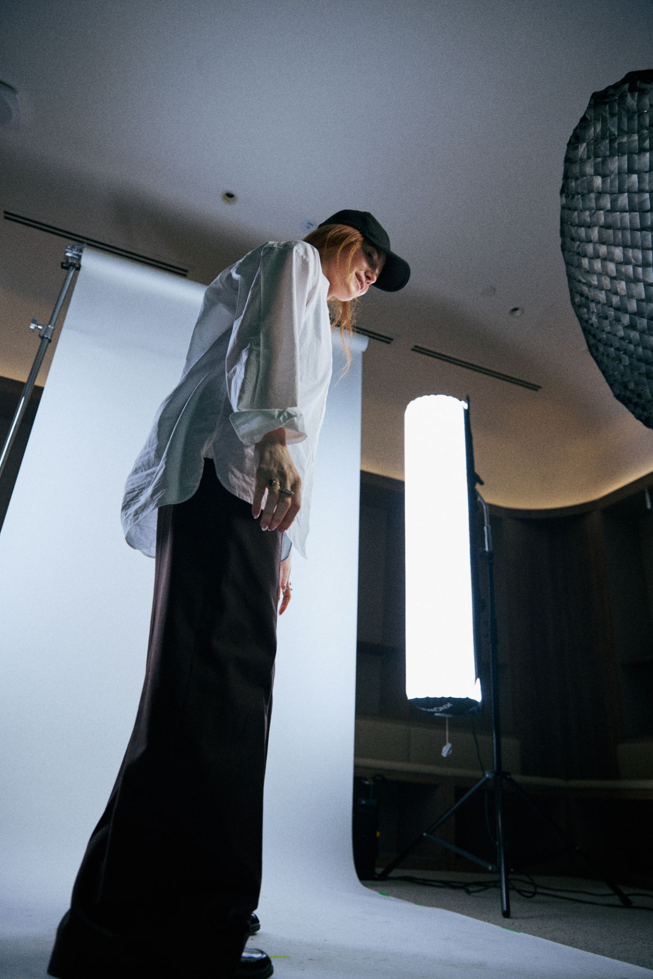 Kristen on a studio shoot, checking the set