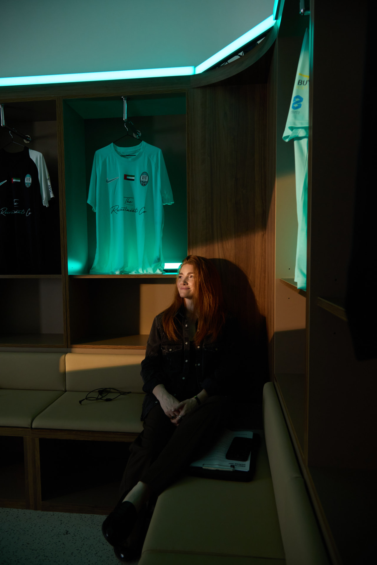 Kristen in the Arabian Falcons FC locker room