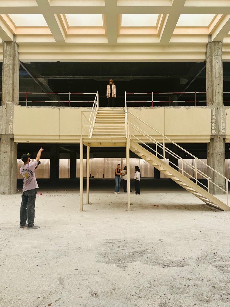 Kristen on a location recce in an unfinished building