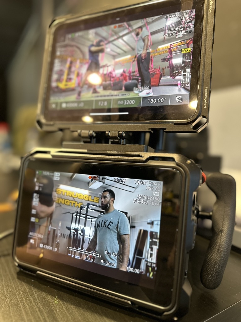 Camera monitors on the Troy Denney pilot episode shoot in the gym