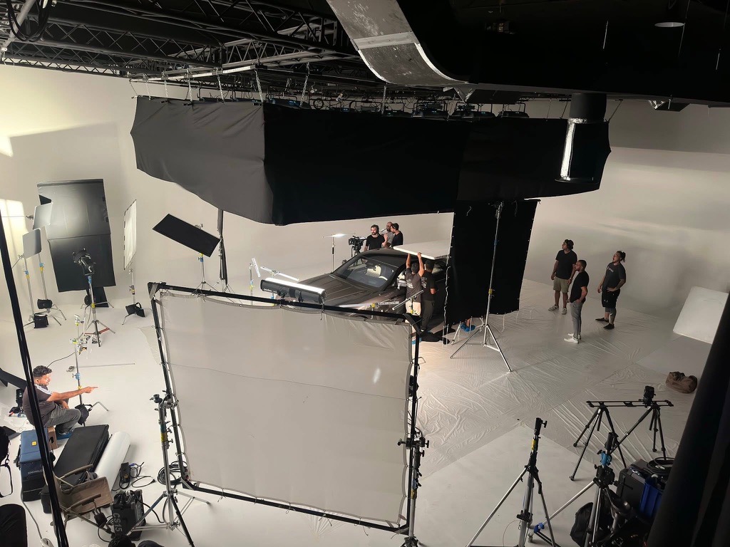 Studio car shoot with lighting and VFX rig