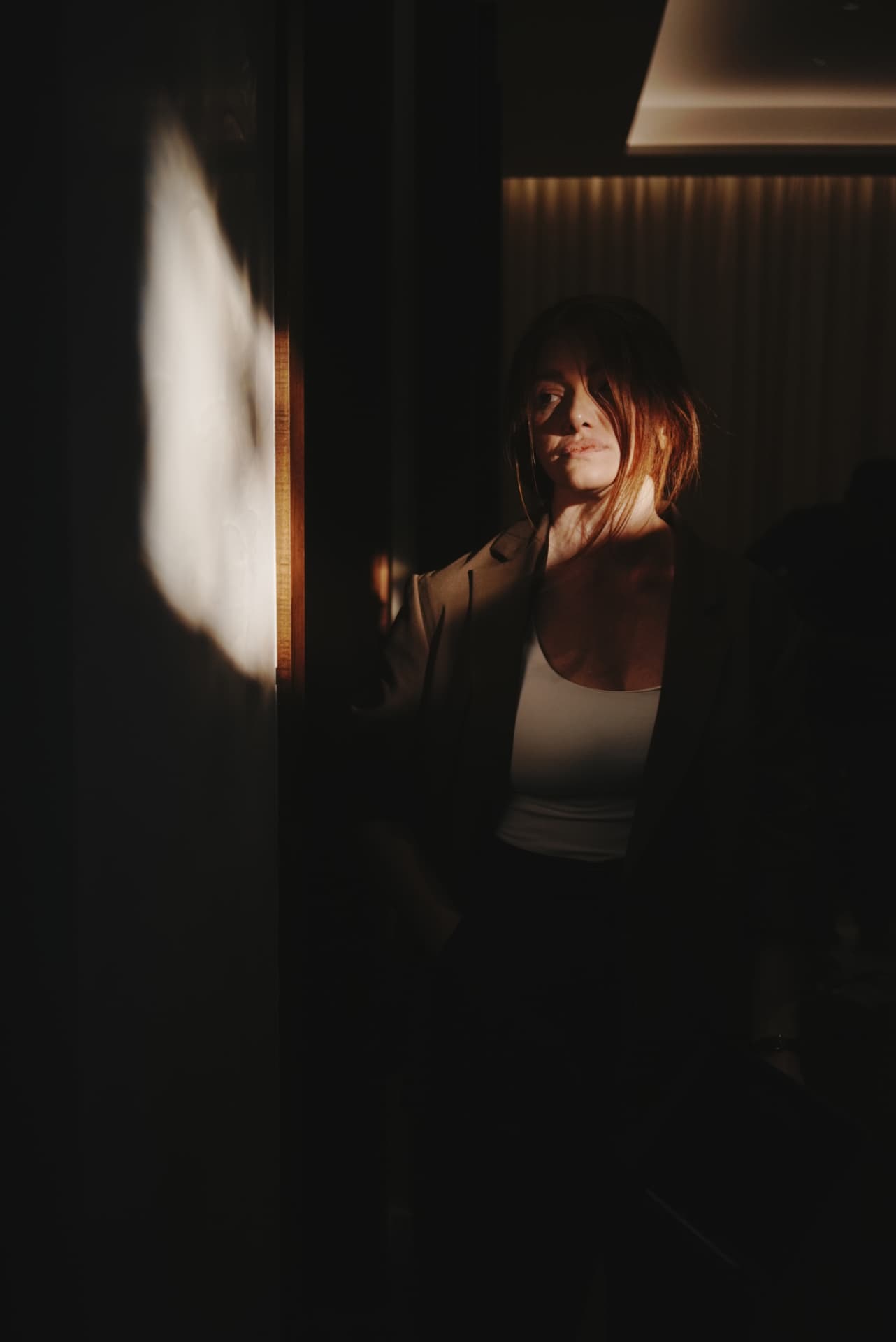 Kristen Johnson in low light between briefs