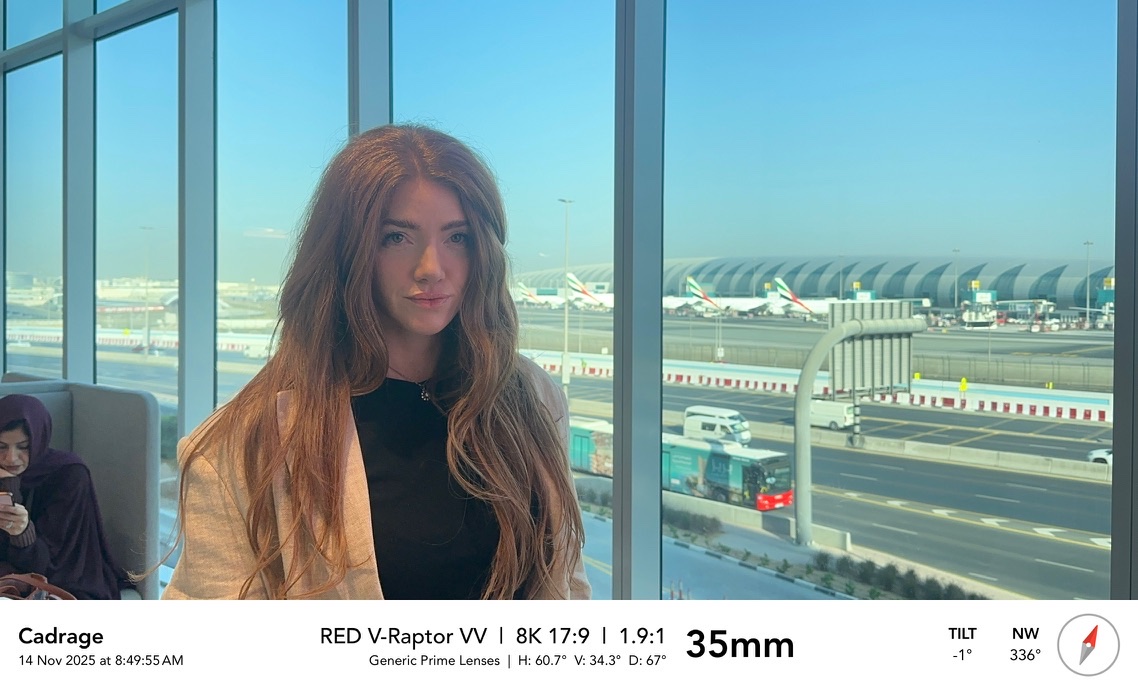 Tech scout at the airport, camera metadata on screen